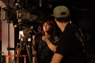 Two crew members talking beside the camera rig